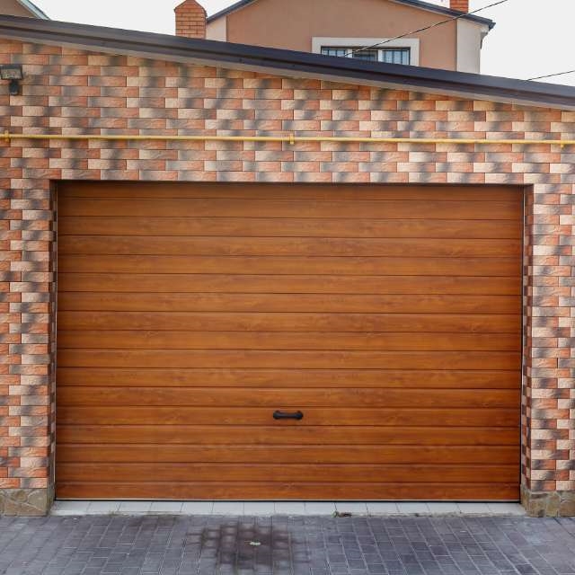Wood panel garage door by Accent Garage Doors